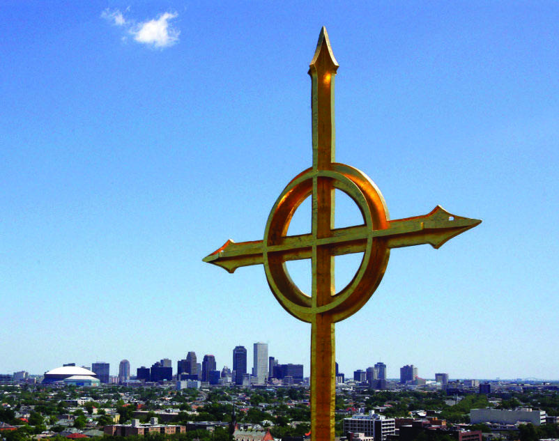 The gilded cross crowning the steeple